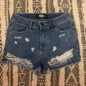 Blue-washed ripped jean shorts